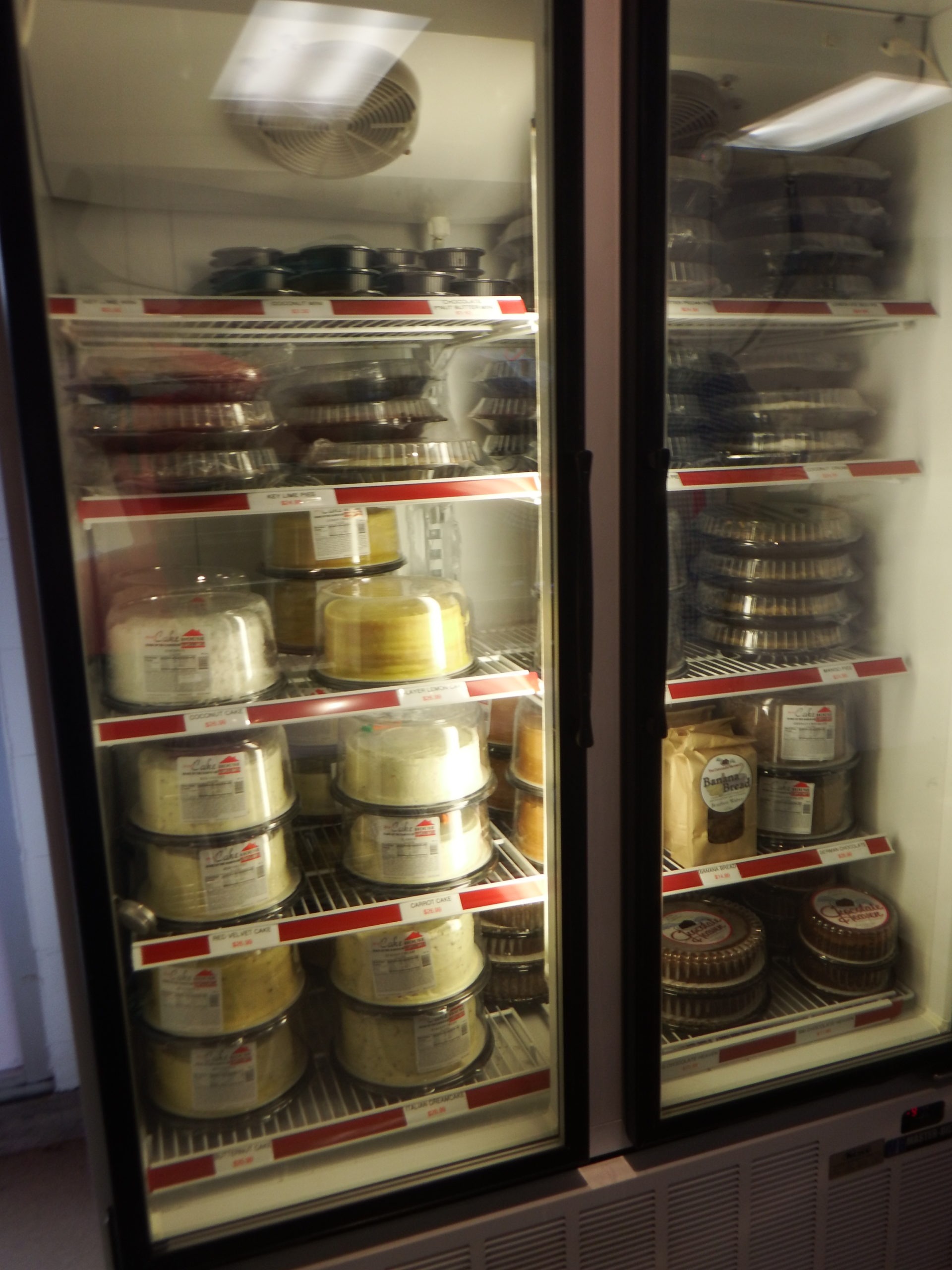 refrigerator with desserts, cheesecakes and pies at Destin Ice