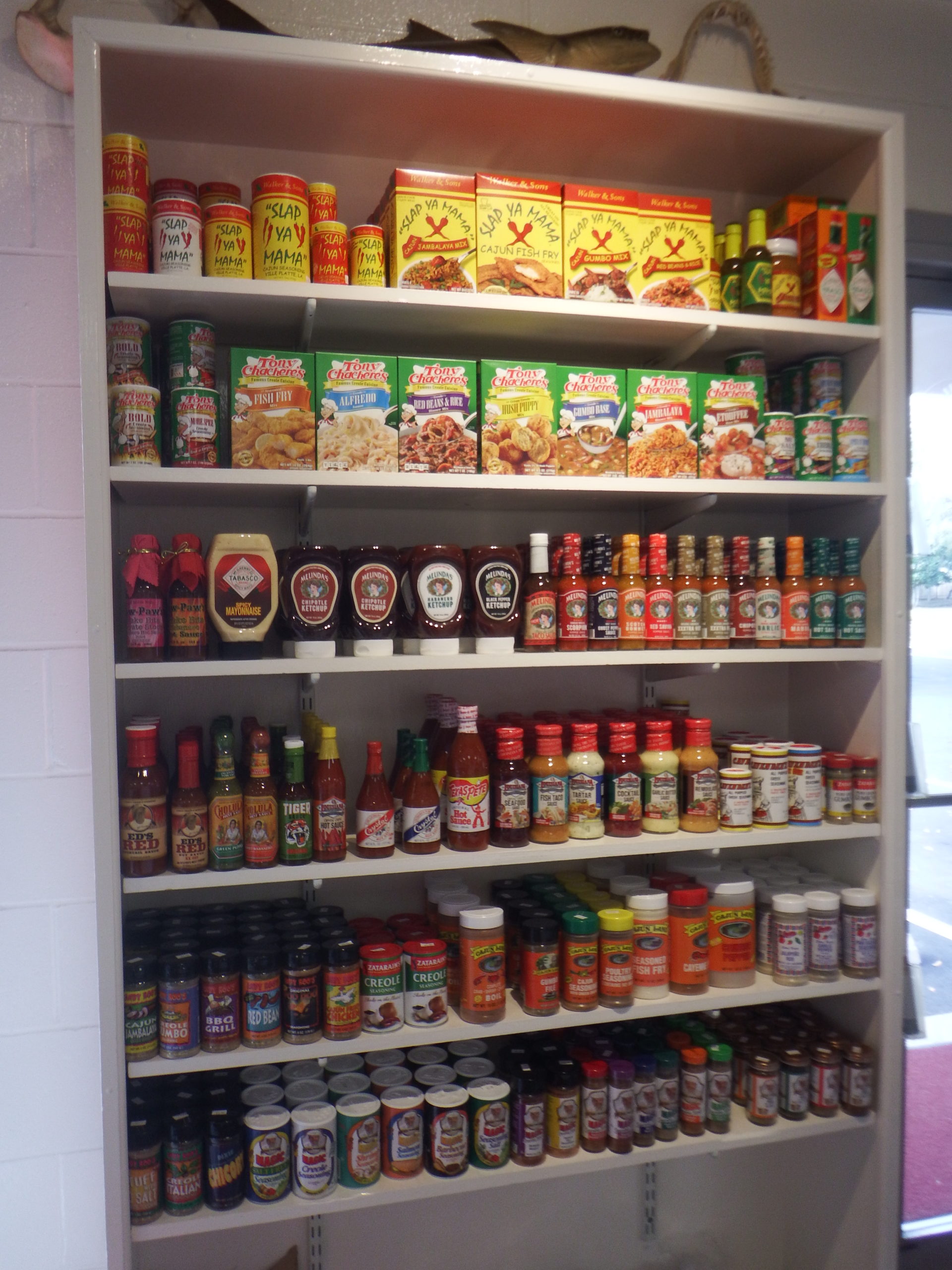 condiments, hot sauce, dried herbs, seasonings for seafood at Destin Ice market