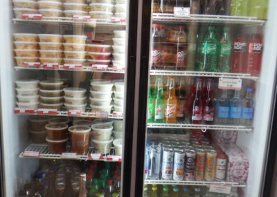 refrigerator with drinks and seafood soups, dips and spreads